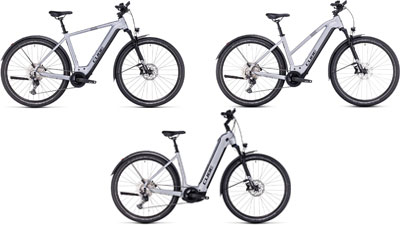 Er zijn drie witte Cube Nuride Hybrid e-bikes te zien, elk met een diamant frame, een trapez frame en een lage instap frame.