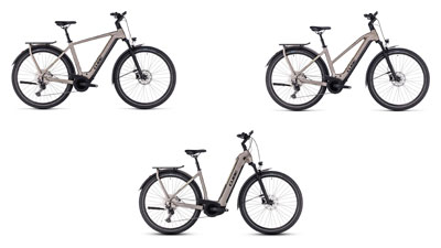 Er zijn drie grijze Cube Kathmandu Hybrid e-bikes te zien, elk met een diamantframe, een trapezframe en een lage instap frame.